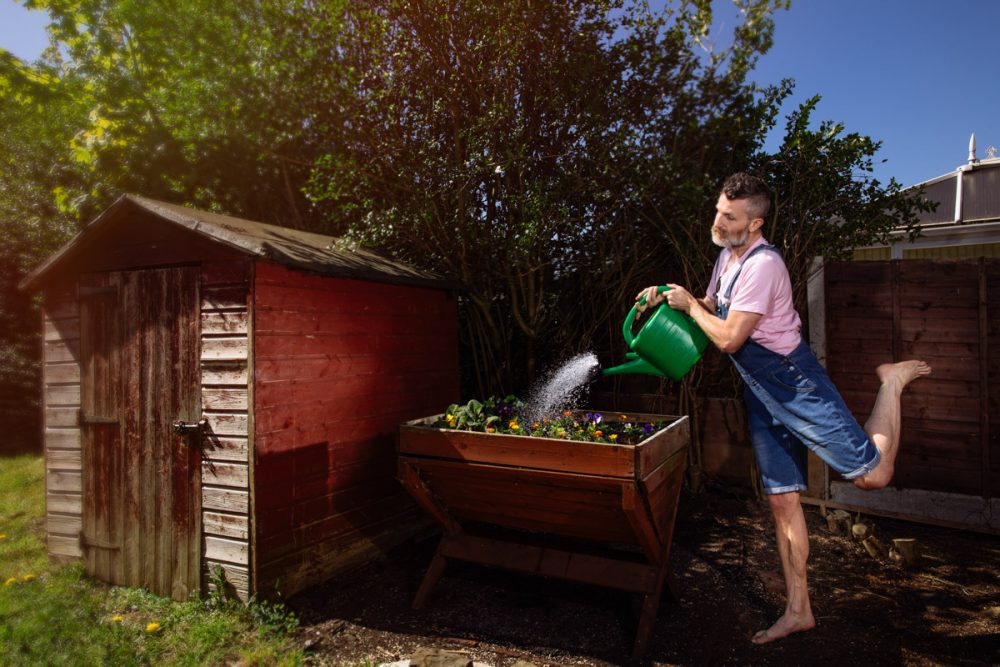 watering the garden in a very camp way